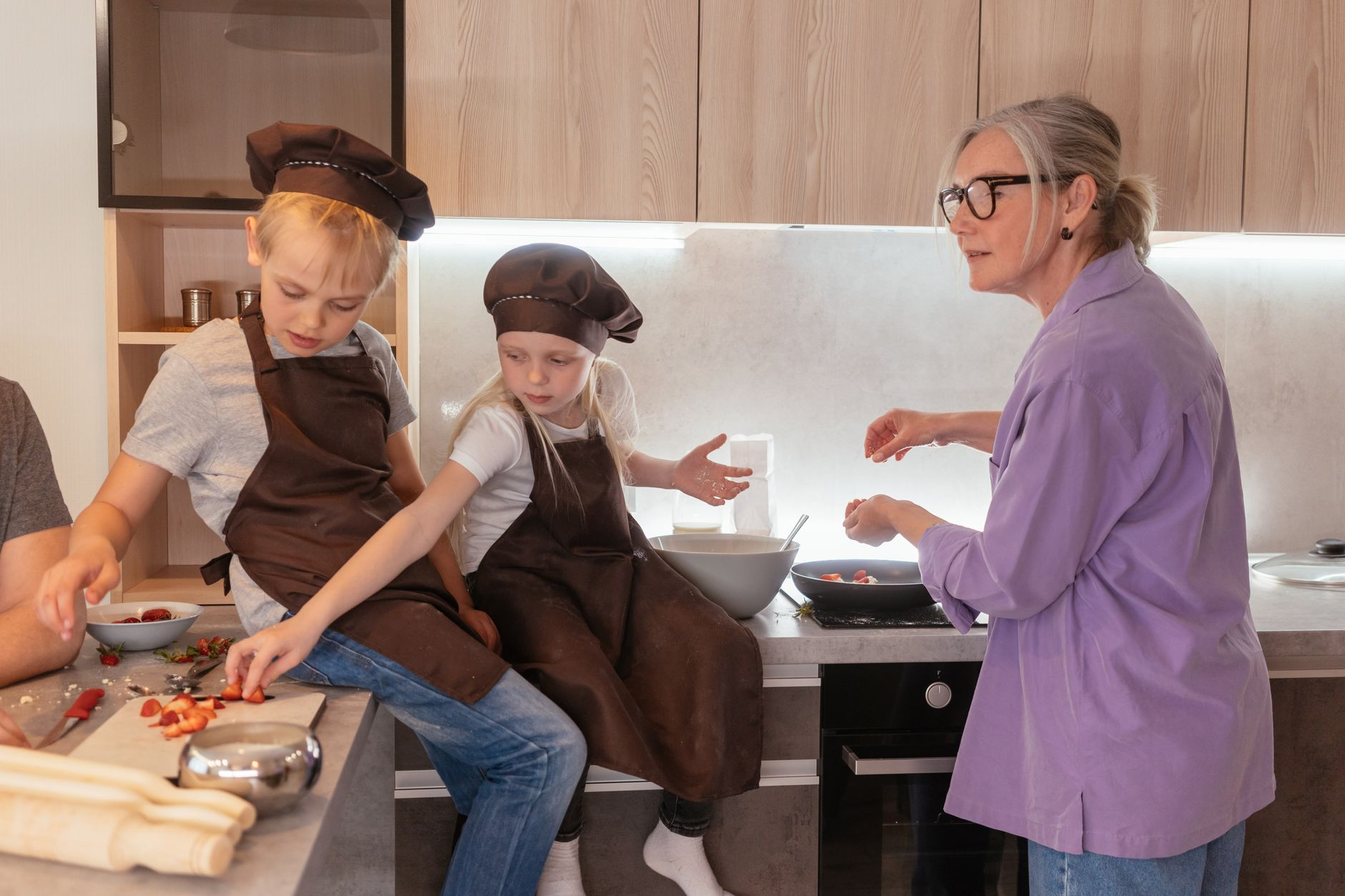 chef teaching couple cooking
