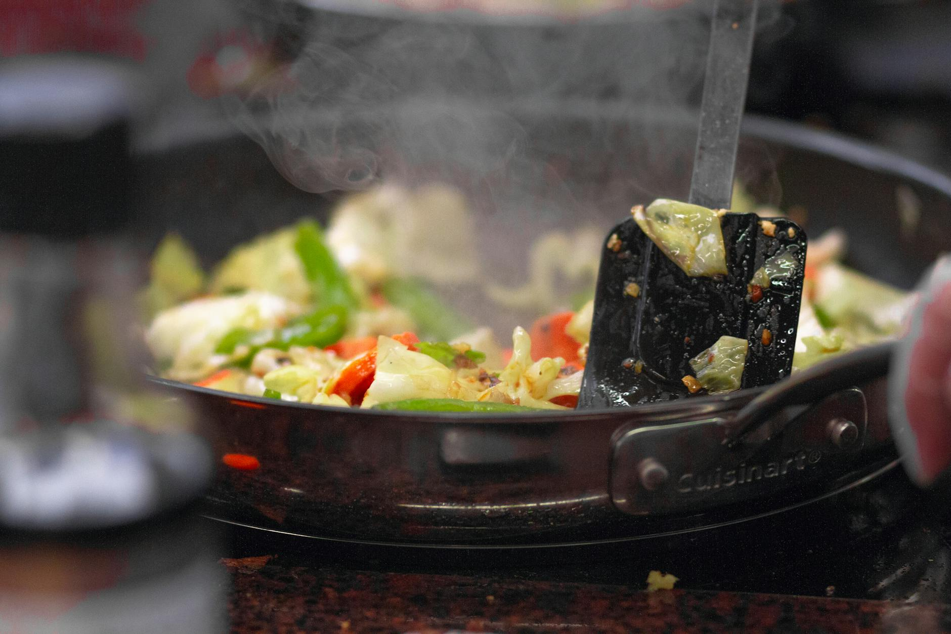 stir-frying cabbage in pan
